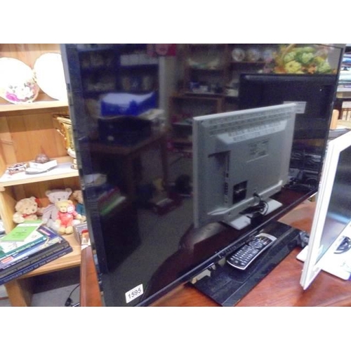 1595 - A Toshiba television with remote control, COLLECT ONLY.