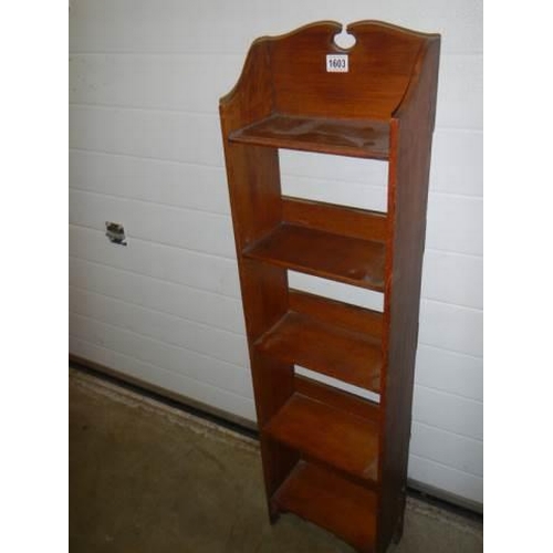 1603 - A narrow five shelf bookcase,. COLLECT ONLY.