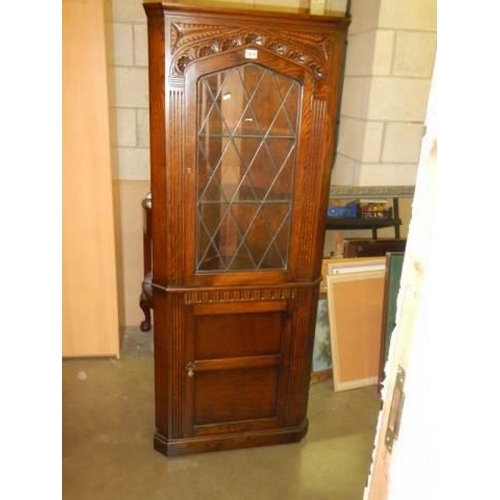 1616 - A good oak corner cabinet. COLLECT ONLY.