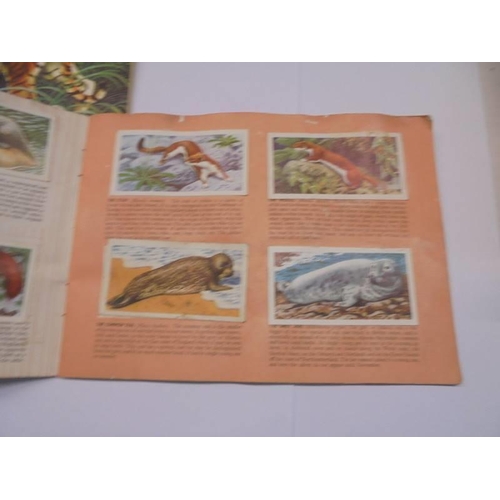 1128 - A quantity of cigarette cards - 12 complete sets, 4 part sets and 3 empty albums.