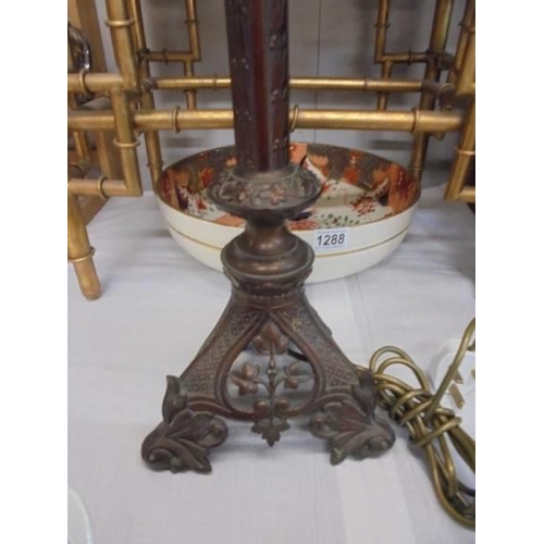 1289 - A tall brass pricket lamp with holophane acorn shade, 75 cm tall. COLLECT ONLY.