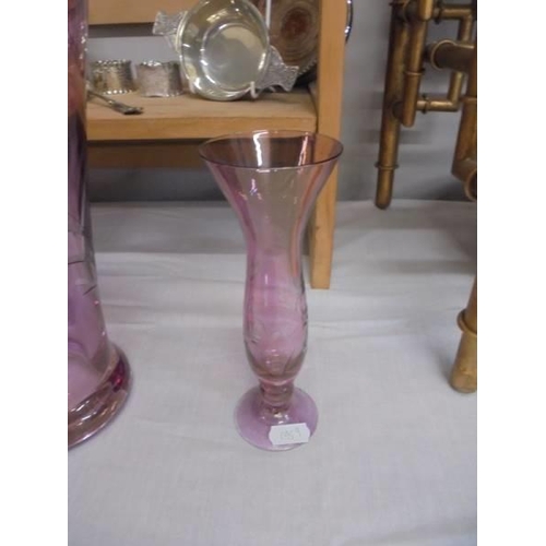 1293 - A tall etched glass vase in purple and a smaller example. COLLECT ONLY.