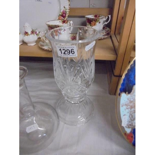 1296 - A cut glass candle lamp, two cut glass bowls and an etched decanter, COLLECT ONLY.