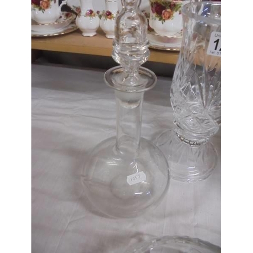 1296 - A cut glass candle lamp, two cut glass bowls and an etched decanter, COLLECT ONLY.