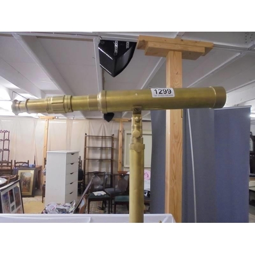 1299 - A brass telescope on tripod.