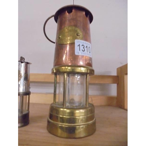 1310 - A Lamp & Limelight Co., brass and copper miner's lam and a small protector lamp.