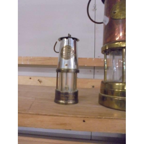 1310 - A Lamp & Limelight Co., brass and copper miner's lam and a small protector lamp.