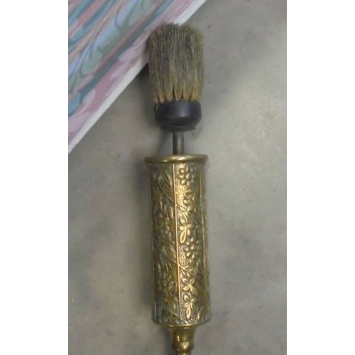 1312 - A brass toasting fork and a brass hearth brush.