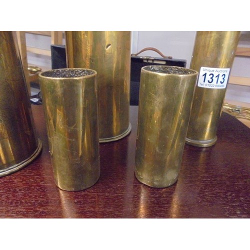 1313 - Five brass trench art gun shell cases.