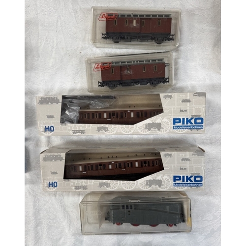 171 - A quantity of HO gauge engines & goods wagons including Lima, Marklin, Piko etc