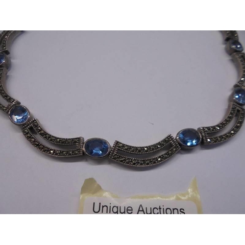 1049 - A silver marcasite choker set with blue stones (925).