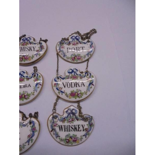 1054 - Nine Crown Staffordshire fine bone china decanter labels.