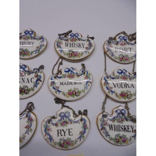 1054 - Nine Crown Staffordshire fine bone china decanter labels.