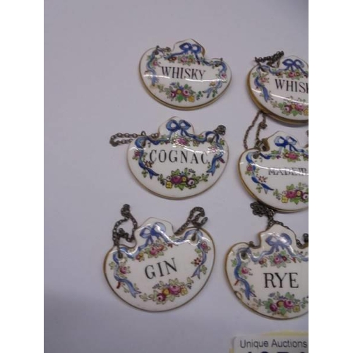 1054 - Nine Crown Staffordshire fine bone china decanter labels.