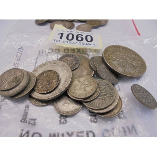 1060 - 28.46 grams pre 1920 silver sixpences and 73.5 grams 1920-1946 silver coins (3.6 ounces).