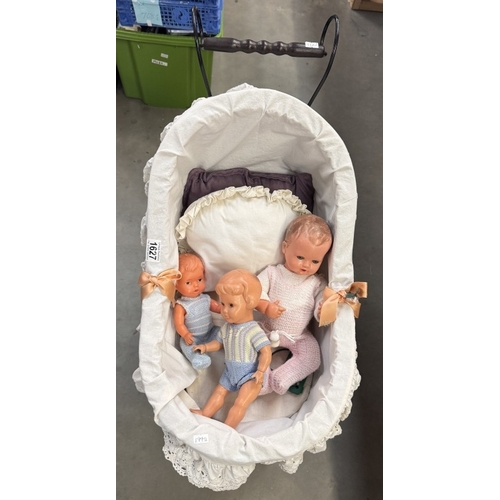 1627 - A Victorian style dolls pram with dolls