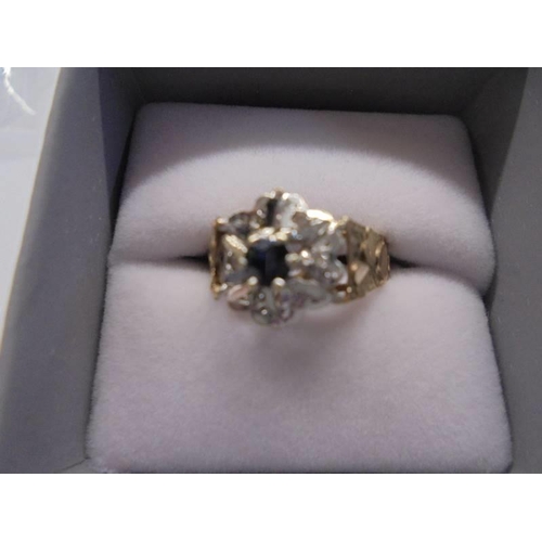 1069 - A diamond & Sapphire ring circa 1970's, textured shoulders in a heart design, hall marked Sheffield ... 