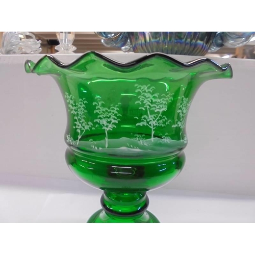 1077 - A green glass Mary Gregory style footed bowl, 25 cm tall.