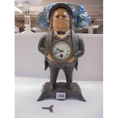 1094 - A cast iron male figure clock.