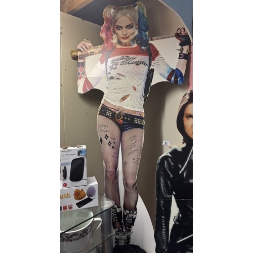 58 - A Harley Quinn standee & 4 Harley Quinn figures