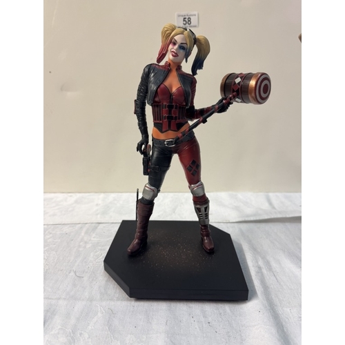 58 - A Harley Quinn standee & 4 Harley Quinn figures