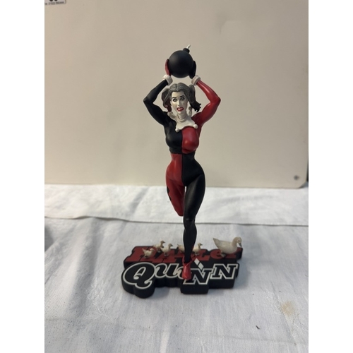 58 - A Harley Quinn standee & 4 Harley Quinn figures