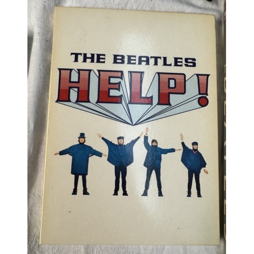 60 - A quantity of The Beatles related figures, Drum set, books, DVDs etc