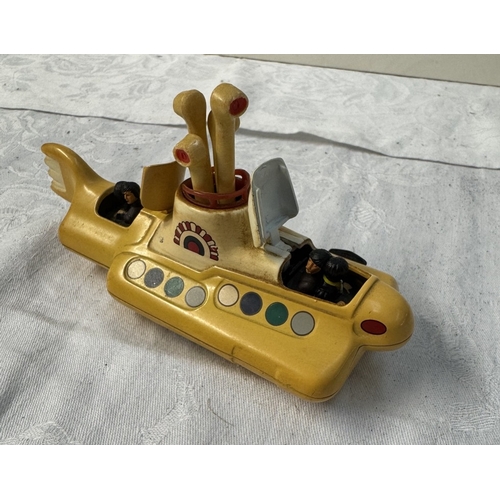 66 - A rare The Beatles yellow submarine model & later Magical Mystery Tour bus & figures