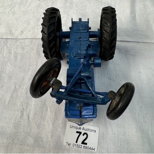 72 - A large vintage Empire made Fordson Major diecast tractor. Length 14cm (Steeing arm A/F)