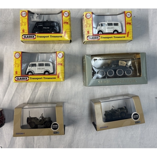 76 - A quantity of boxed HO gauge plastic diecast vehicles including Britania, Oxford, Diecast etc