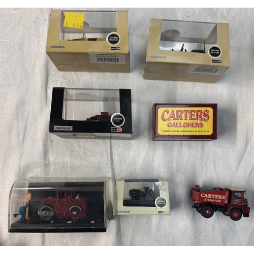 76 - A quantity of boxed HO gauge plastic diecast vehicles including Britania, Oxford, Diecast etc