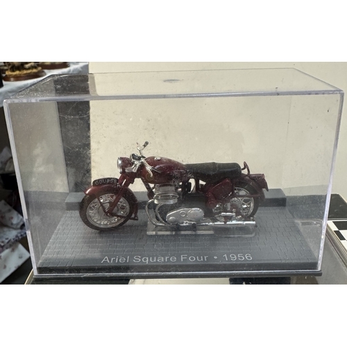 106 - A quantity of boxed motorcycle models including Norton, Vincent, Royal Enfield etc & A boxed scooter... 