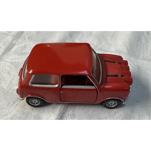 108 - A boxed Corgi Italian Job diorama & A three piece Mini set