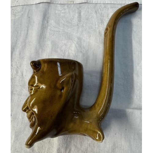 111 - A studio pottery pipe with a devil head bowl