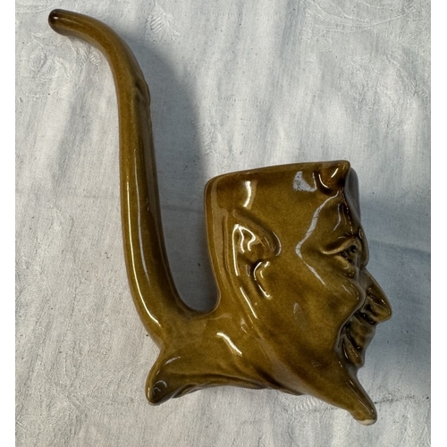 111 - A studio pottery pipe with a devil head bowl