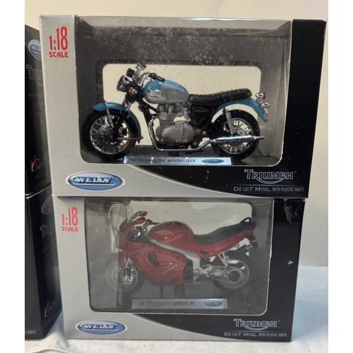 113 - 6 Triumph boxed motorcycles by Welly. Scale 1:18