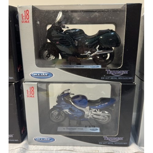 113 - 6 Triumph boxed motorcycles by Welly. Scale 1:18