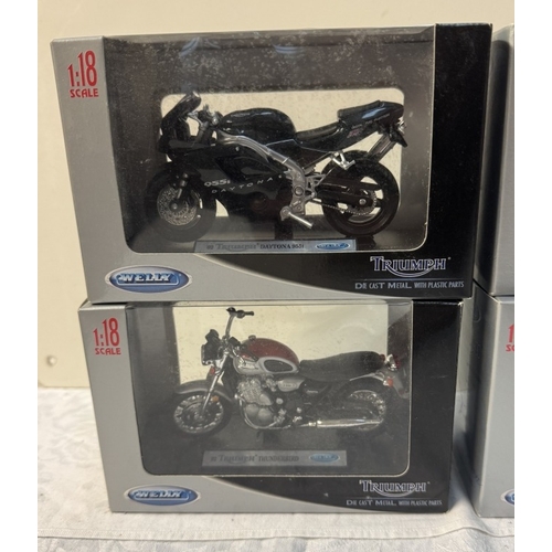 113 - 6 Triumph boxed motorcycles by Welly. Scale 1:18