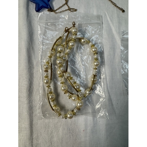 90 - A quantity of yellow metal & pearl necklaces & bracelets