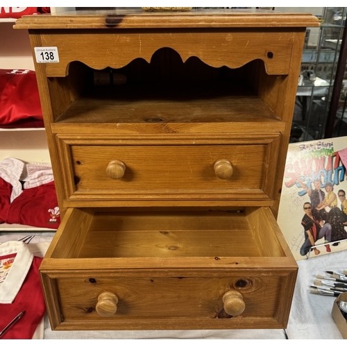 138 - A solid waxed pine bedside chest with 2 drawers & shelf