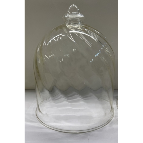 1150 - Two glass domes with twisted swirl design