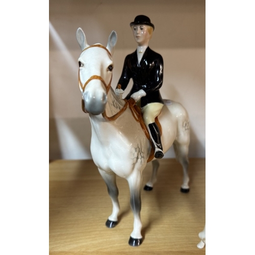 1157 - A Beswick dapple grey horse with rider, Smaller Beswick horse with rider & 3 Beswick hunting hounds