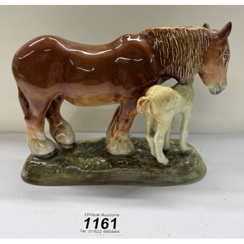 1161 - A Royal Doulton HN 2522 shire horse & foal