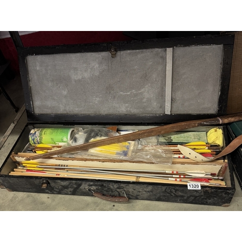 1320 - An old English long bow together with two cases of arrows and accessories. COLLECT ONLY.