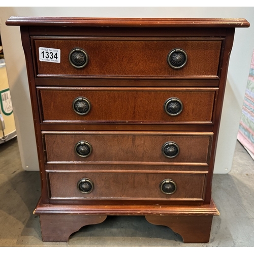 1334 - A small mahogany four drawer chest. COLLECT ONLY.