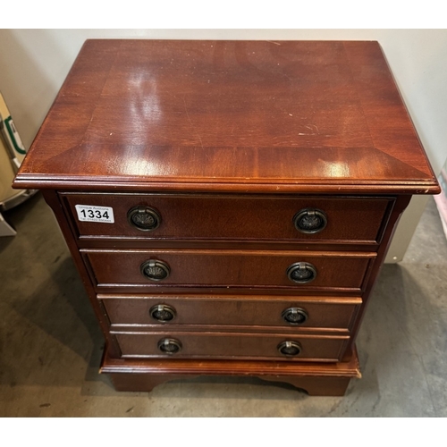 1334 - A small mahogany four drawer chest. COLLECT ONLY.