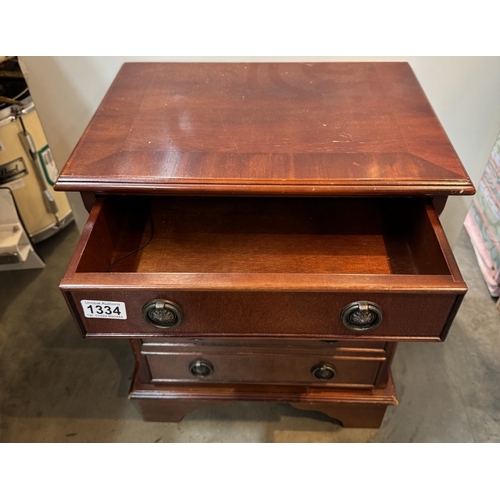 1334 - A small mahogany four drawer chest. COLLECT ONLY.