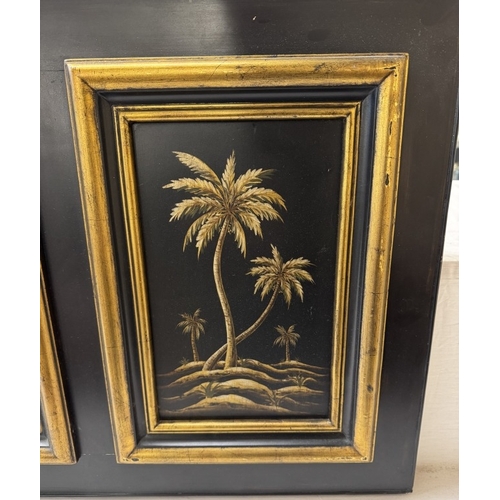 1342 - A classical style gilt & black framed bevel edge mirror with palm tree panels. 112 x 48cm