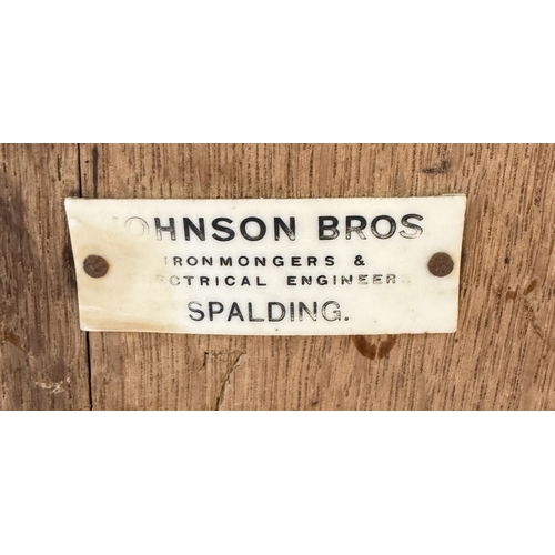 1362 - A 19th / 20th century large oak butter churn by Johnson Bros Spalding for Wade Leeds