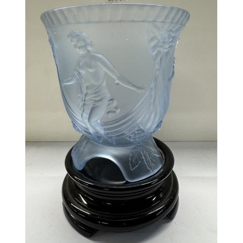 1100 - A blue glass vase featuring female figures on a black glass base.